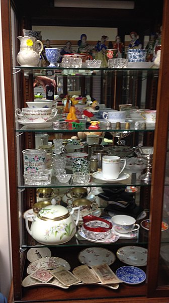 Vintage Estate Lot: Vintage Estate Lot includes Occupied Japan Victorian figurines, Lamoge, Noritake, 1950's Bakelight pencil sharpeners; airplane, Pluto,and telephone, 5 thimbles and currency from the war, egg cups, sal