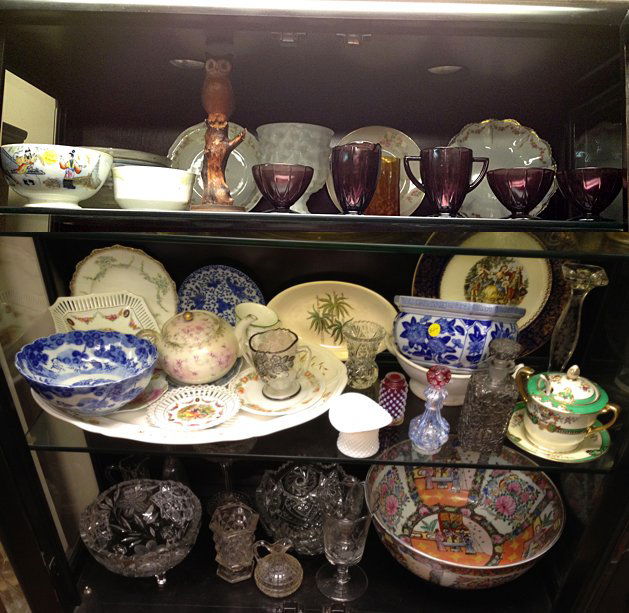 3 Shelves Vintage Estate Lot: 3 Shelfs including Oriental motif large bowl, and deep purple glass, Timor bowl, pressed glass bowls, flow blue, hobnail salt shaker, wooden owl figurines, decorative plates, decanter, vases, etc. Nic