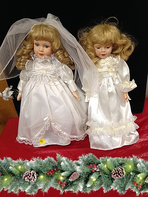 St. Jude Item: 2 Porcelain Bride Dolls: To Benefit St. Jude Children's Research Hospital; 2 Porcelain Bride Dolls Measures approx. 15" tall each. These dolls are being auctioned to benefit St. Jude Children's Research Hospital. We have been