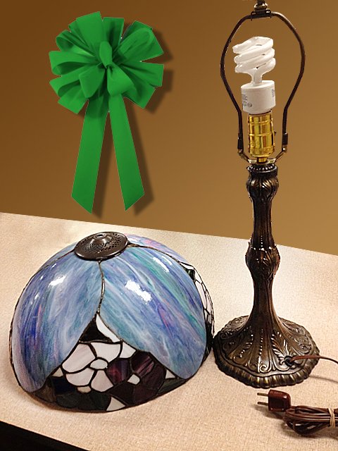 St. Jude Item: Estate Leaded Glass Table Lamp: To Benefit St. Jude Children's Research Hospital; Estate Leaded Glass Table Lamp. Very nice decorative leaded glass lamp with flowers. Top of shade needs to be resoldered. This lot is being auctioned 