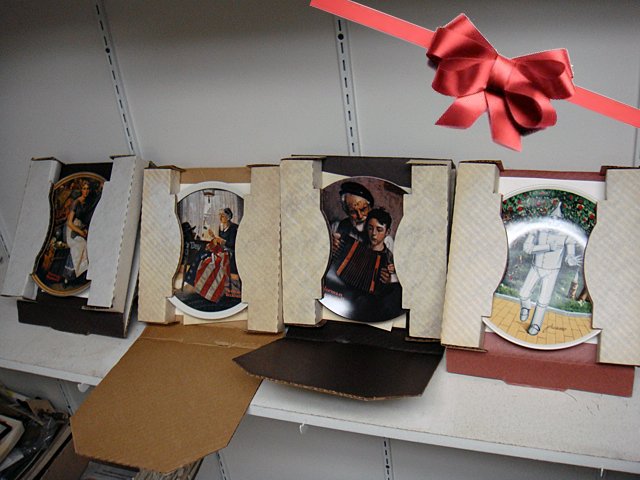 St. Jude Item: 4 Collectors Plates: To Benefit St. Jude Children's Research Hospital; 4 Collectors plates including 2 Norman Rockwell, The Tin Man from the Wizard of Oz, and The Edwin M. Knowles China Co. These plates are all in their o