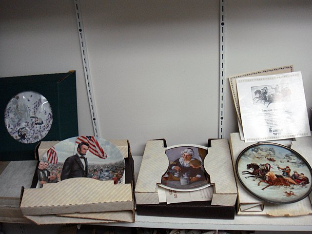 St. Jude Item: 8 Collectors Plates: To Benefit St. Jude Children's Research Hospital; 8 Collector's Plates including Norman Rockwell with Christmas Plates, Scarecrow from the Wizard of Oz, Abraham Lincoln, Russian Sleigh scene, Russian 