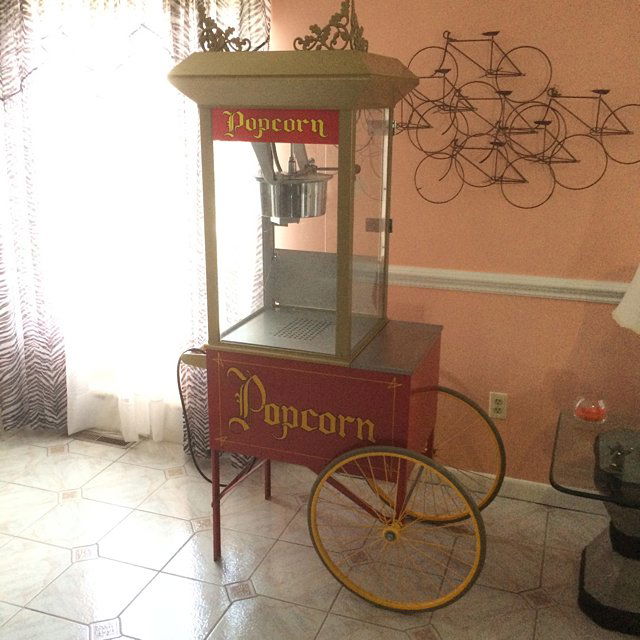 Popcorn Cart: Full size vintage Popcorn Cart! Beautiful condition with decorative finials on top, red with gold accents. Reminiscent of carnival and circus vendors, movie theaters, and truly a part of home town Ame