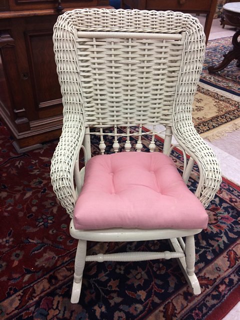 Child's Wicker Rocker: Very nice child's wicker and wooden rocking chair, painted white with pink, thick cushion.