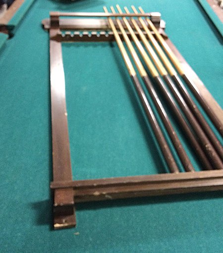 Brunswick-Balke-Collender Co.Cue Stick Holder: Vintage Brunswick-Balke-Collendar Co. wall mount cue stick holder, matches pool table in previous lot. Very nice vintage rack in original finish with label. This cue holder can be picked up in Morris,