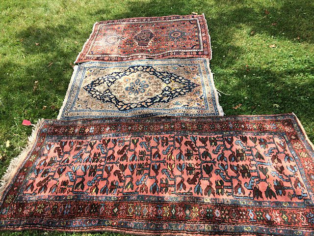 3 Antique Persian Rugs: 3 Antique Persian Rugs, all hand made / hand knotted, 100" wool Persian. Larger rug with pink, blue and red trim measures approx. 77" long x 38" wide; Light blue and biege with dark blue medallion mea