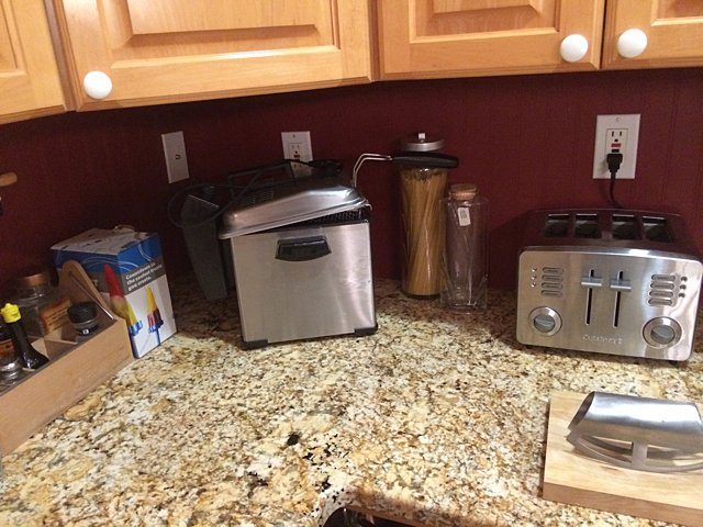 Kitchen Counter Top Contents: Kitchen Counter Top Contents include stainless steel double toaster, deep frying unit, juicer, caddies, etc.