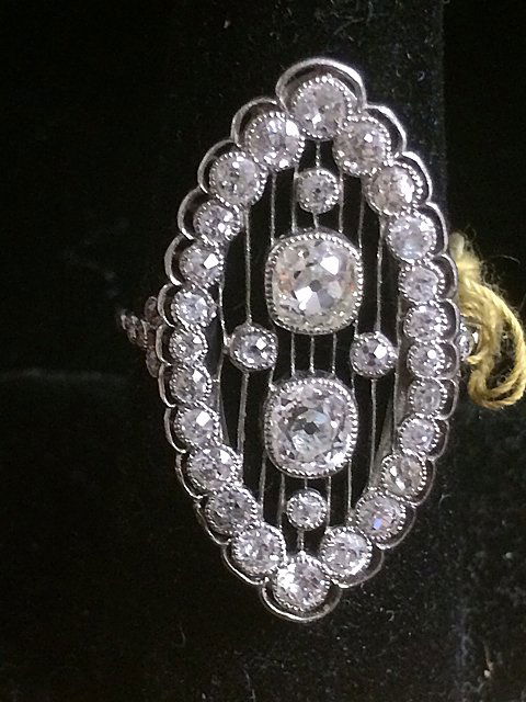 18kt Platinum and Diamond Ring: c. 1910 Vintage hand made 18kt platinum ring with Old Mind Cut diamonds. 2 Old Mine Cut 1.08 ct; 35 Old Mine Cut 1.75 ct. Exceptional ring!