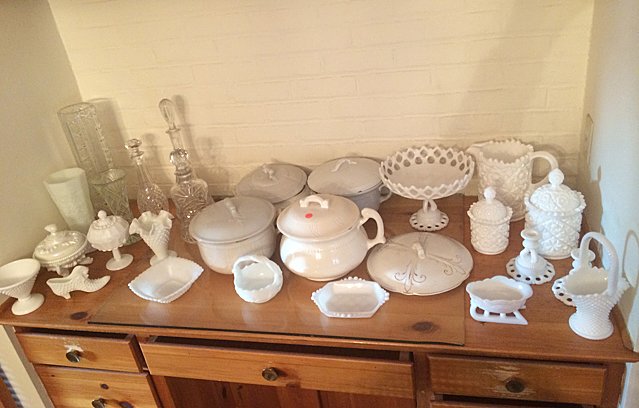 Milk Glass, Iron Stone & Crystal Lot: Nice collection of milk glass including baskets, covered jars, pitcher, vases, etc., Ironstone covered tureens, and crystal decanters, and vases. These items must be picked up or shipped from Bristol,
