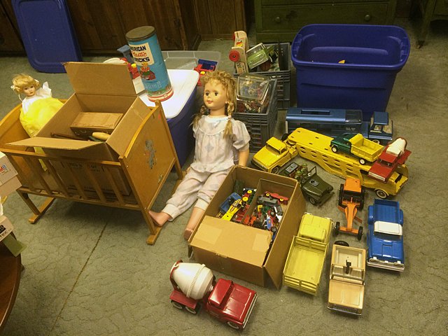Vintage Estate Toy Lot: Vintage estate toy lot includes dolls, vintage toy trucks and cars including Tonka, doll cradle, figures, train set, and additional vintage toys. These items must be picked up or shipped from Bristol,