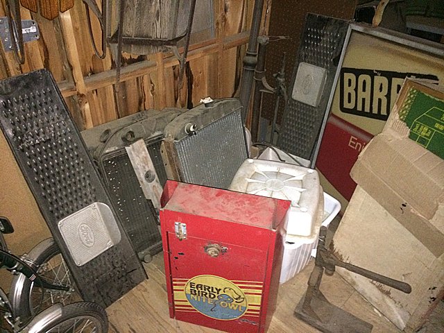 Automotive Lot: Automotive lot includes Ford truck running boards, radiators, Early Bird Nit Owl cabinet, vintage bottle capper, new craps game table, pully, hooks and chain, Boraxo hand soap dispenser, etc.