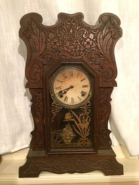 Session Gingerbread Clock: Art Nouveau style Gingerbread clock by Sessions Clock Co., Bristol, CT. Heavily carved with butterflies on the glass. Very uncommon model
