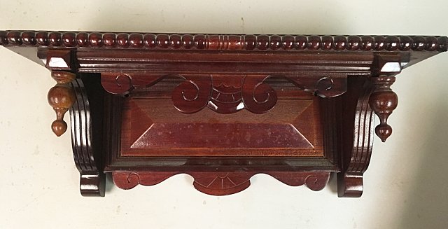 Carved Clock Shelf: Carved Clock Shelf, with beaded edge, carved base.