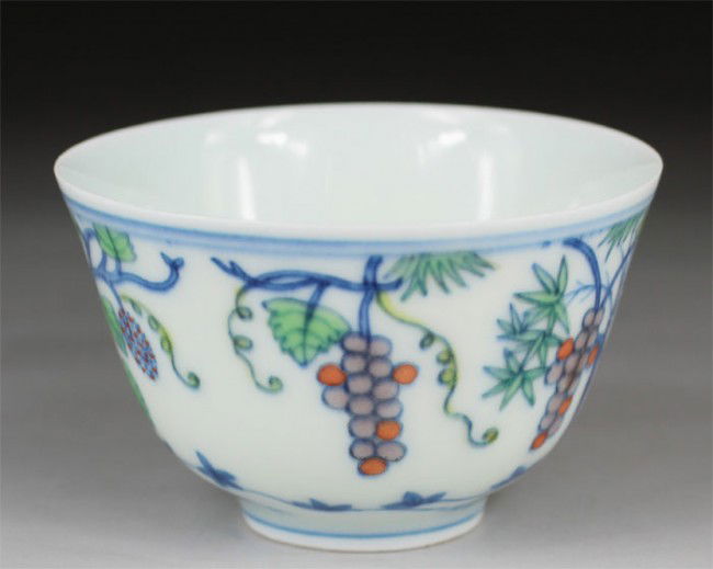 Chinese Doucai Tea Cup: Chinese Doucai Tea Cup with design.Six character mark on base "Da Ming Cheng Hua Nian Zhi".H 1.97",Dia 3.03".