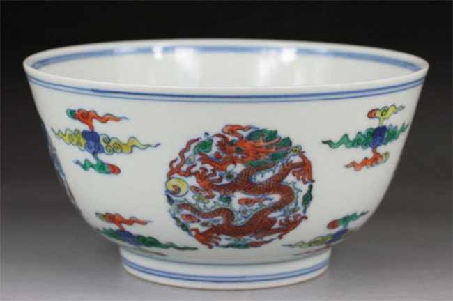 Chinese Doucai Bowl: Chinese Doucai bowl,The motif on the bowl displayed here includes four groups of medallion dragons and clouds.Six character mark on vase "Da Qing Kang Xi Nian Zhi".H 3.15".Dia 5.91