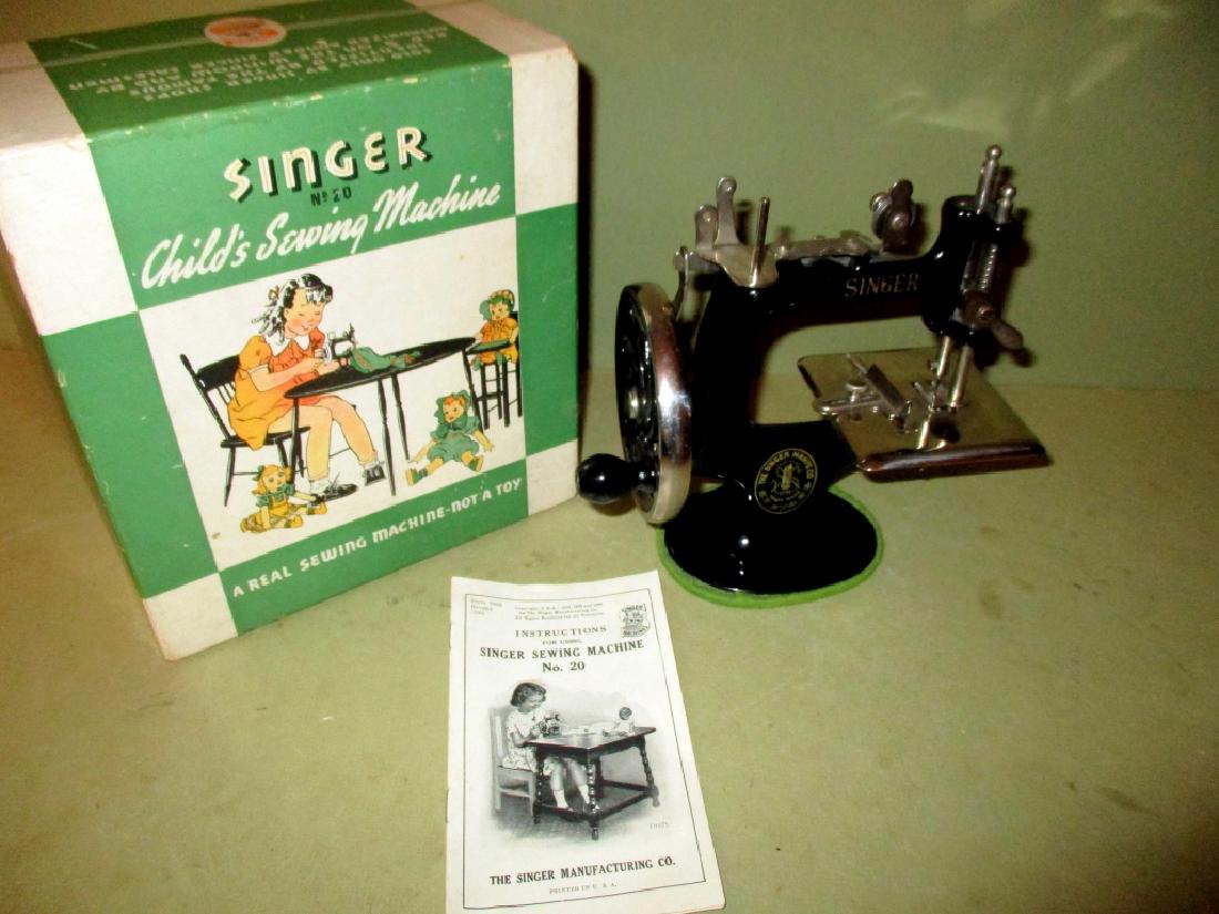 Child's Singer Sewing Machine: Child's Singer sewing machine with original box and directions in very good condition.