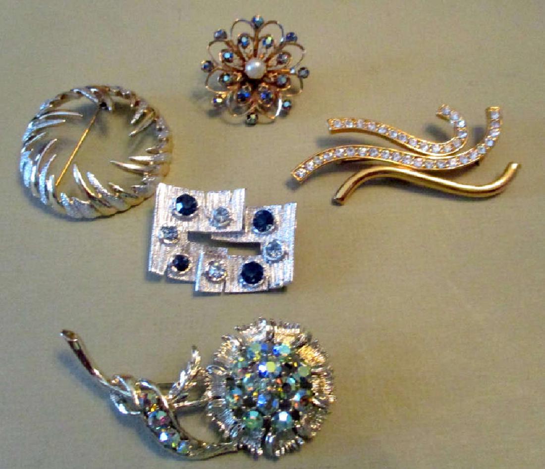 Five Vintage Costume Brooches: Lot consisting of one brooch signed Monet, one signed Sarah, and three unsigned. All in good condition.