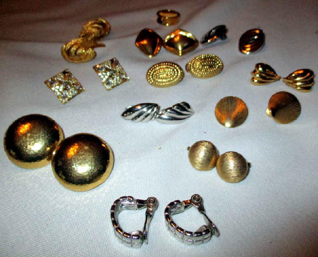 Lot of Monet Vintage Earrings: Eleven pairs of Monet clip earrings and one ring. All in good condition.