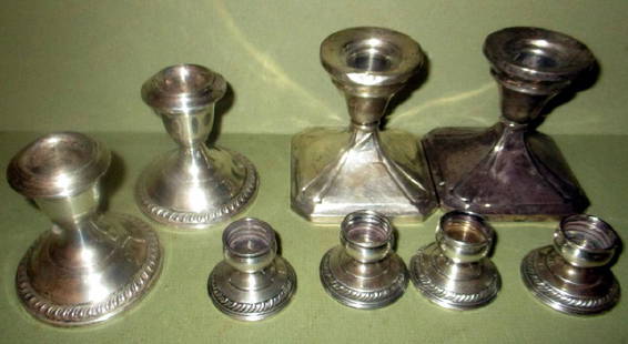 Lot of Sterling Candleholders: Lot of sterling candleholders. Two pair and a set of four small candleholders. Some minor dents, fair to good condition. Weighted.