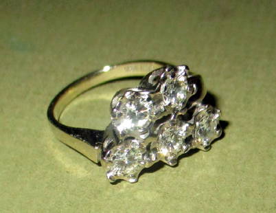 Lady's Diamond Cluster & 14K Gold Ring: Lady's diamond cluster ring with five approximately .1 Carat or more of full-cut diamonds set in 14K white gold. Size is approximately 5 1/2.