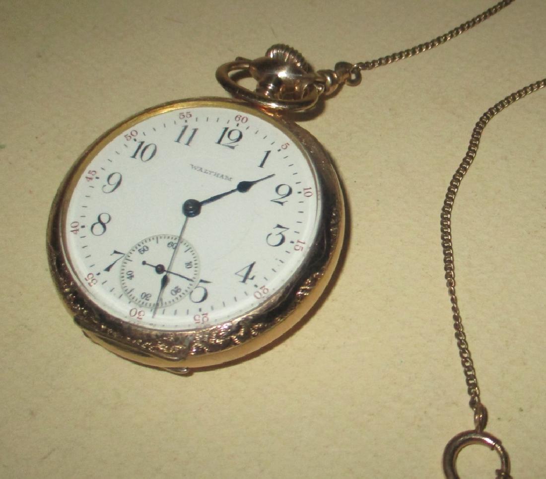 Men's Gold Filled Waltham Pocket Watch: Men's Gold Filled Waltham Pocket Watch with watch chain attached. In good condition. Diameter is approx. 2" inches.