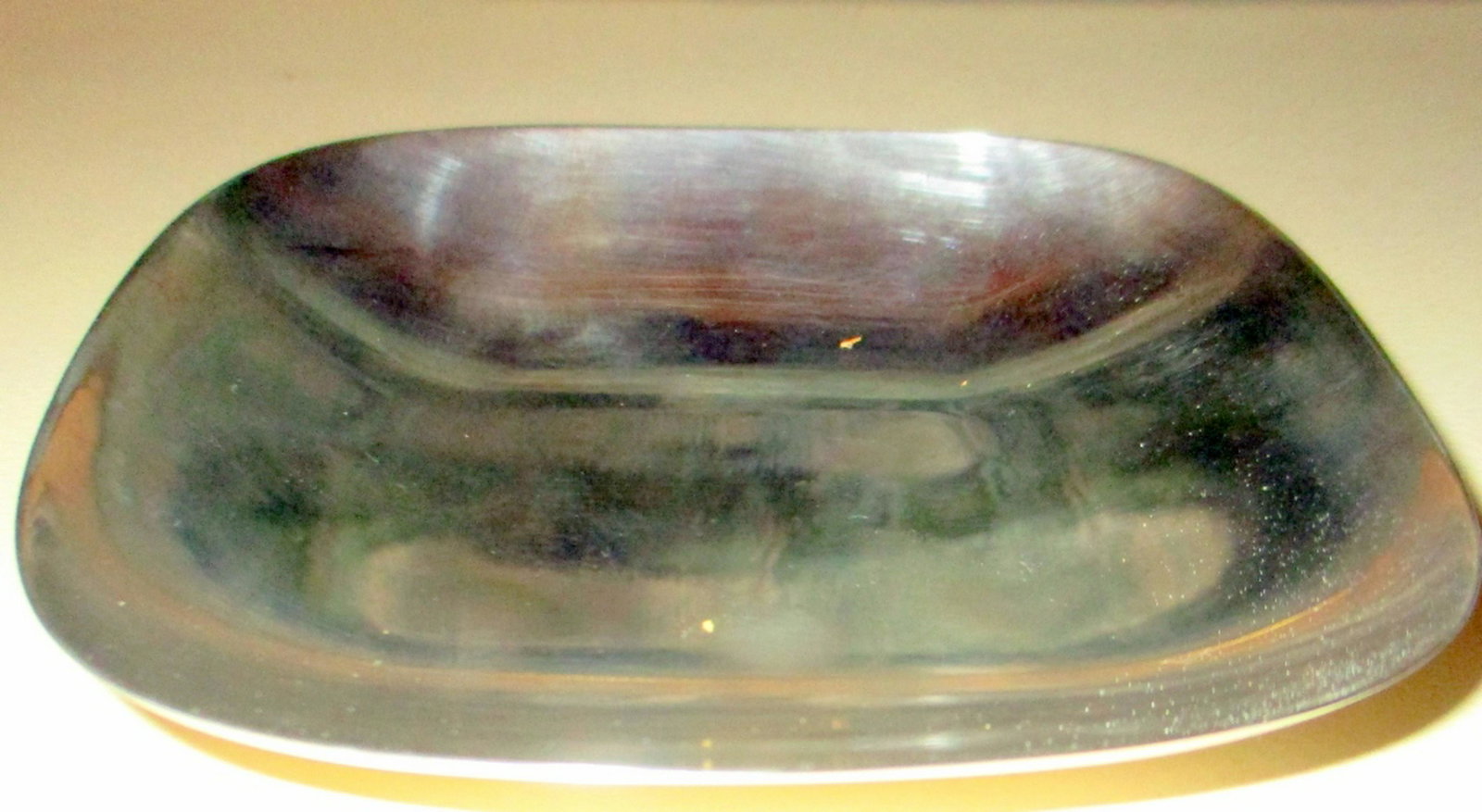 Tiffany & Co. Sterling Lemon Dish: Tiffany & Co. Sterling Lemon Dish. Square shape with rounded corners. It measures approx. 5" inches by 5" inches across the top and 3/4" of an inch high. In good condition. Approx. weight is 4.25 OZT.