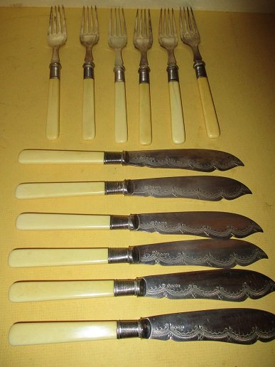 Set of Fish Knives & Forks W/ Bone Handles: Service for 6 fish set of flatware, consists of 6 bone handle forks and 6 bone knives, The Knives are hallmarked, Possibly English? Fair to good condition