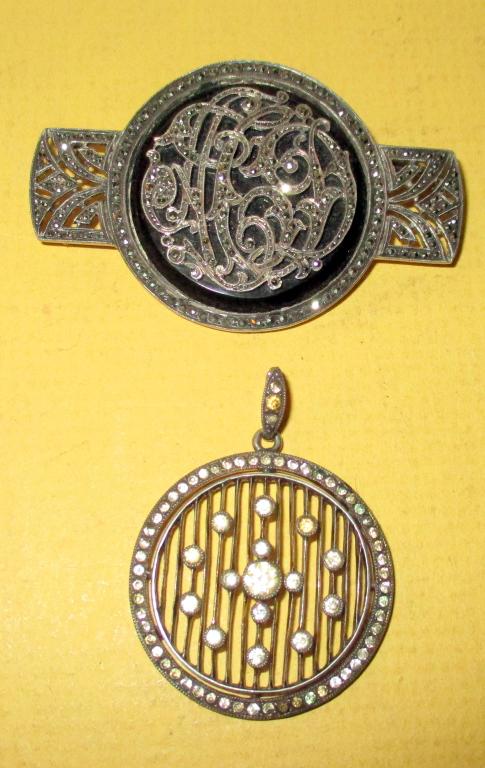 Two Sterling Pieces of Jewelry: Lot consists of two pieces of sterling jewelry set with stone. One is a Deco sterling brooch set with black onyx and marcasites and a Deco sterling pendant set with rhinestones. Both in good condition