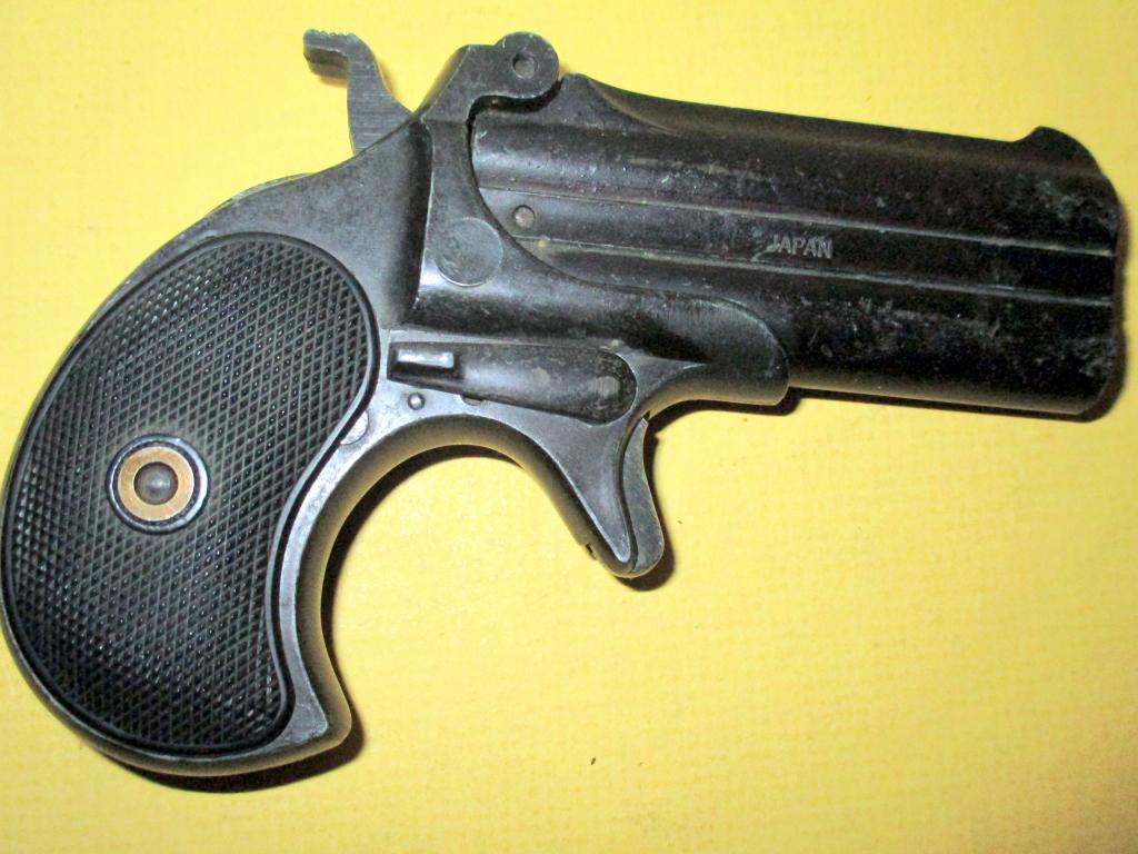 Japanese Replica of a Derringer: A Japanese repro of a frontier Derringer and is not a working gun. Approx. size is 5" inches long, not in working order.