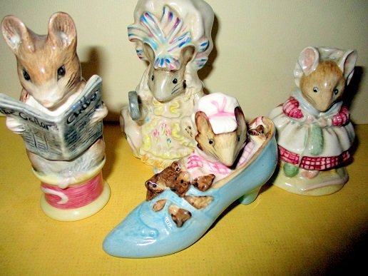 Four Beatrixx Potter Figurines off Mice: Lot consists of "The Old Woman Who lives In a Shoe", " Appley Dapply", Johnny Towne Mouse" and "Lady Mouse", All in very good condition and all made in Beswick England