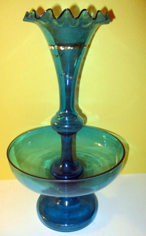 Victorian Blue Glass Epergne: Lot consists of a blue glass epergne with some gilt decoration on the center trumpet vase. Some minor wear to the gilt. Approx size is 12" inches tall in fair to good condition.