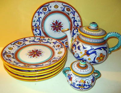 Lot of Augusta Deruta Pottery, Circa 1920's/30: Lot Consists of 6 Salad/Dessert Plates, Approximate Size is 8" inches Diameter, a Teapot Approximately 6" inches Tall and a Covered Sugar 3 1/2" inches tall. Unfortunately no Creamer. All in Good