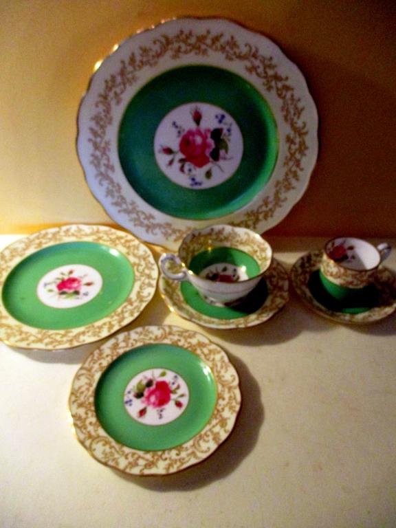 Swansea English Bone China Dinner Service for 10: Consists of a Swansea English Bone China "Swansea Rose" Dinner Service complete for 10. Set has 11 Dinner Plates, 12 Teacups/Saucers, 12 Demitasse Cups/Saucers, 12 Bread Plates and 10 Dessert Plates. 