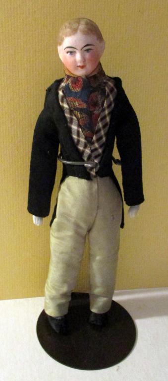 Boy Doll: Lot Consists of an Adolescent Boy with Bisque Porcelain Head and Dressed in Semi Formal Attire. Approximate Size is 8 1/2" Tall. In Good Condition. No Chips or Cracks.