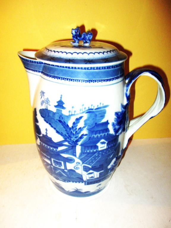 Canton Style Strap Handle Pitcher: Lot Consists of a Canton Style Strap Handle Pitcher With Cover. Made by Mottahedeh. Approximate Size is 11" inches Tall and Approximately 9" inches Wide. In Very Good Condition.