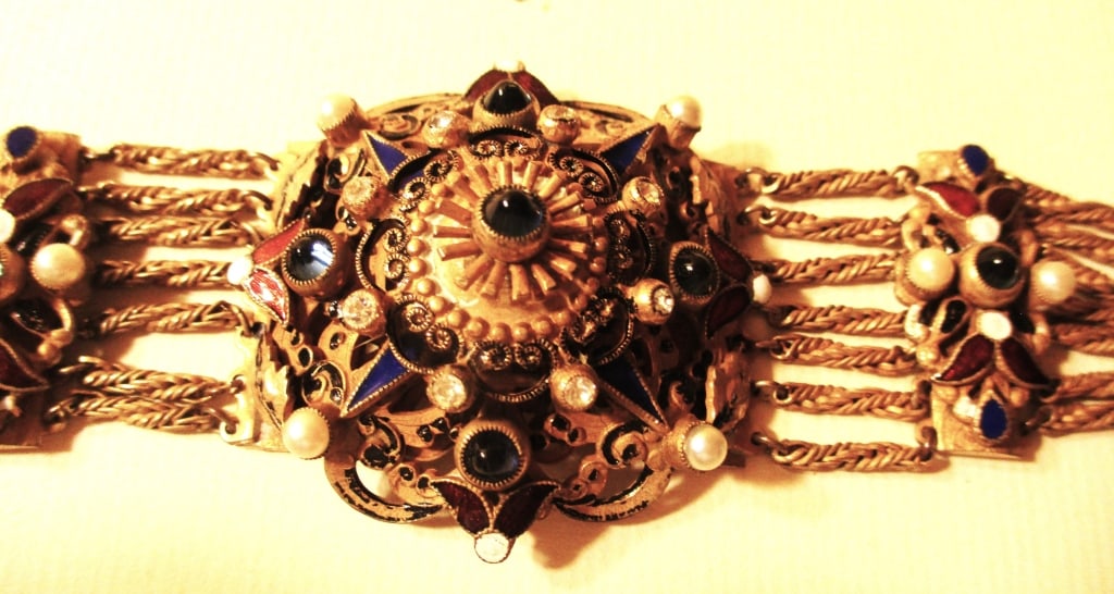 Two Pieces of Czechoslovakian Costume Jewelry: Lot Consists of a Czechoslovakian Bracelet with Faux Jewels, Circa 1920, Approximately 7" inches Long. Also a Necklace with Jewelry Pendant Hanging From a Gold Toned Chain, Approximately 22" inches Lo