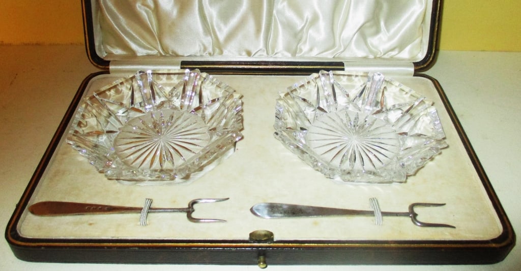 Pair Overall Cut Glass Dishes and 2 Sterling Forks: Lot Consists of 2 Cut Glass Pickle Dishes with 2 Sterling Forks in Their Own Case, Made by Terry Co. of Manchester. In Good Condition.