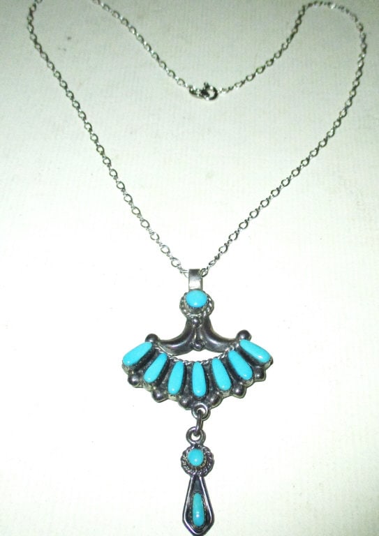 Sterling and Turquoise Zuni Pendant: Lot Consists of a Signed Zuni Silver and Turquoise Set in the Pendant, Suspends From a Sterling Chain. Chain is Approximately 16" Inches Long. Signed Bill and Lou Zuni.