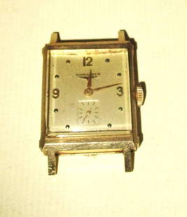 14K Longines Man's Wristwatch: Lot Consists of a Man's Longines Wristwatch. It is not Working. Maybe from the 1940's/50's. Approximate Weight 13 dwt. Doesn't have a Wrist Band. Case is Fair to Good Condition.