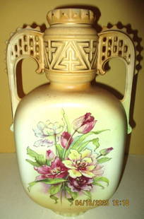 Austrian Porcelain Vase: Lot Consists of an Austrian Marked Hand Painted Porcelain Vase with Floral Decoration on the Front. It is 12" Inches Tall. In Good Condition.