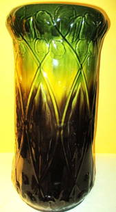 Majolica Umbrella Holder: Lot Consists of a Majolica Umbrella Holder. It isn't Cracked but has 2 Chips in the Glaze of the Body. The Motif is Art Noveau. In Fair to Good Condition. The Approximate Size is 22 1/2" Inches 