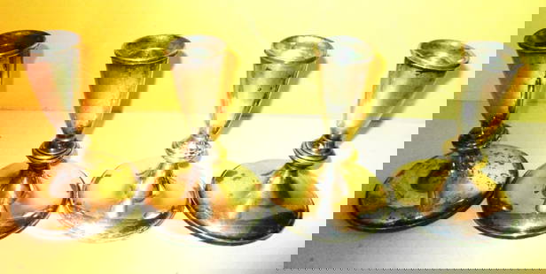 Four Sterling Candle Holders: Lot Consists of 4 Weighted Sterling Candle Holders. In Fair to Good Condition. Since these candlesticks are weighted we cannot guaranty a weight