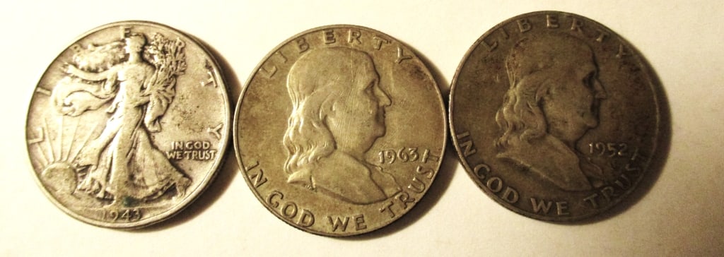 Three Silver Half Dollars: Lot Consists of Three Silver Half Dollars. Two are Benjamin Half Dollars and one is a Liberty Half Dollar. Approximate Weight is 1.2 ozt. In Fair to Good Condition.
