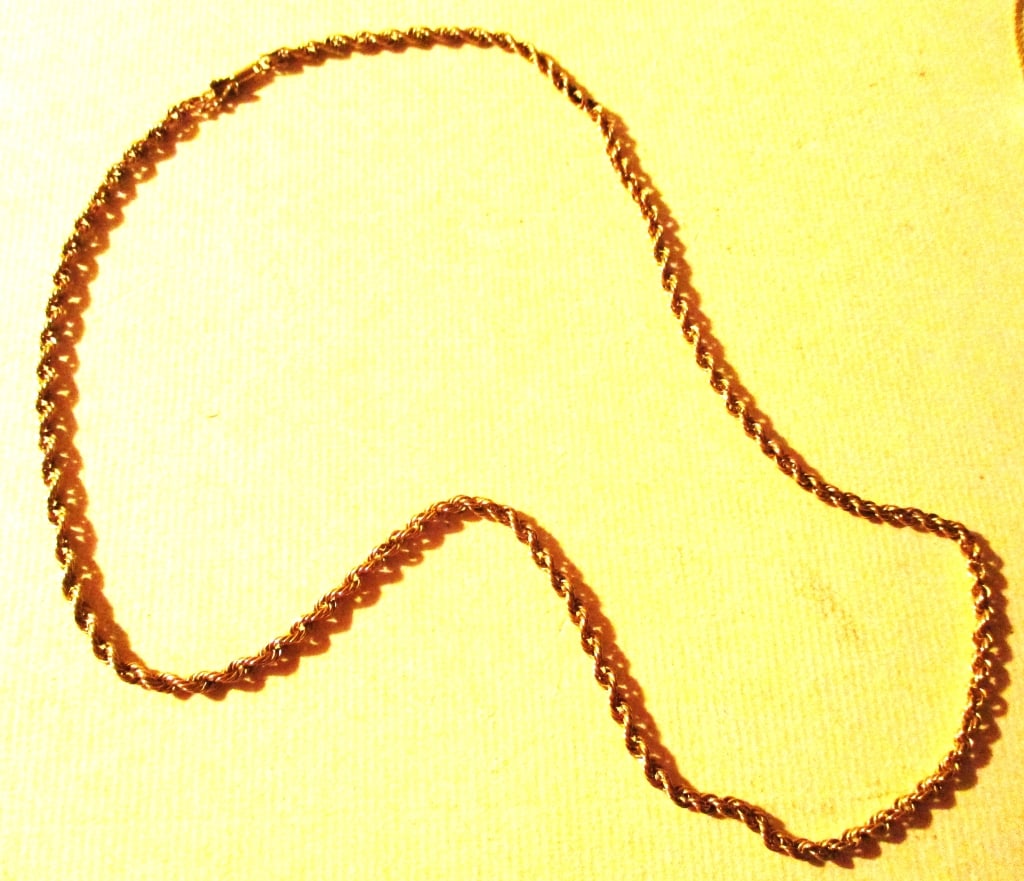 14K Gold Roped Neck Chain: Lot Consists of a 14K Yellow Gold Neck Chain. The Chain is Designed in a Rope Style. It Has an Approximate Weight of 3 dwt. Approximate Length is 20" Inches Long. In Good Condition.