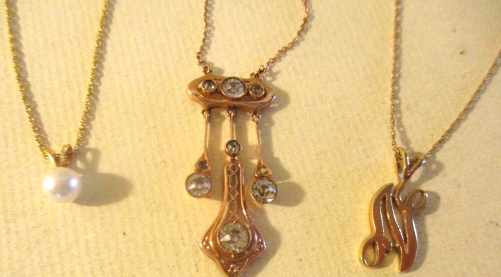 Three 10K Gold Pendants With 14K Gold Chains: Lot Consists of Three 10K Gold Pendants With 10K Gold Chains. Chain Sizes Vary, 1 is 14" Inches, Another is 16" Inches, Another is 18" Inches Long. Approximate Weight is 3.8 dwt. All in Good Condition