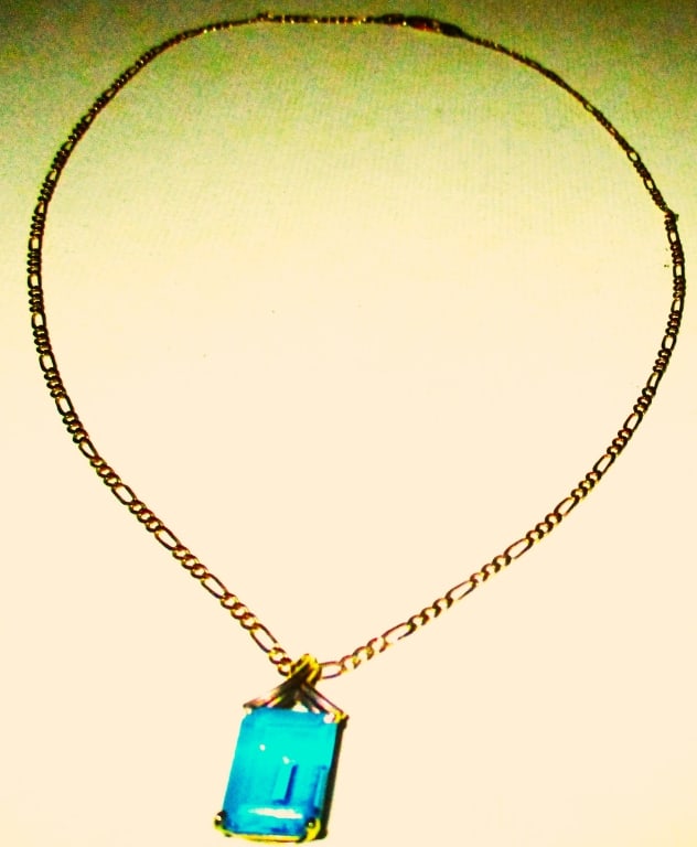10K Gold Pendant Set W/Blue Topaz &14K Gold Chain: Lot Consists of a 10K Gold Pendant Set With Blue Topaz? Suspended From a 14K Gold Neck Chain. The Total Approximate Weight is 4.8 dwt. The Stone is Cut Like an Emerald Cut. Pretty Good Condition. Size