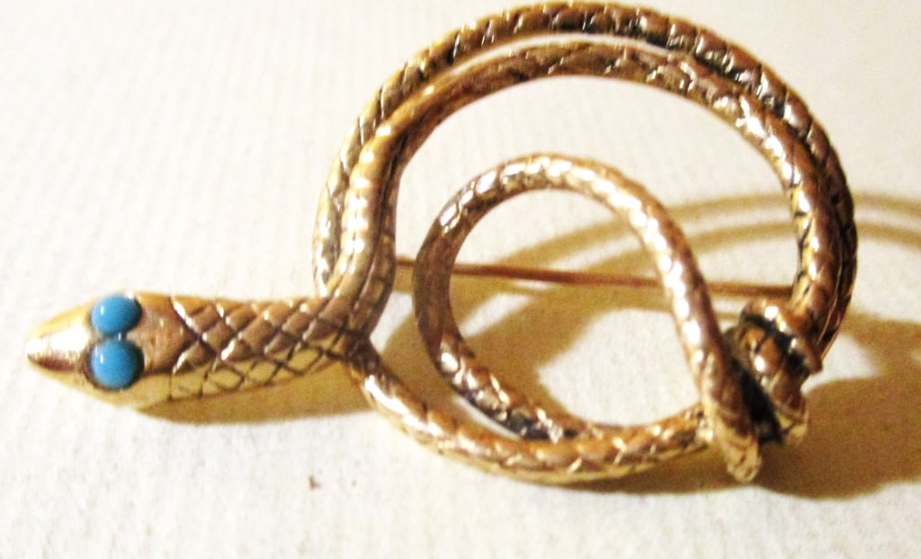 14K Yellow Gold Brooch With Snake Motif: Lot Consists of a 14K Gold Brooch in a Snake Motif With Emerald? Eyes. Very Unusual Brooch, Circa 19th Century. Approximate Weight is 7.7 dwt. In Good Condition