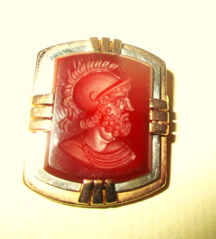14K Gold Brooch With an Intaglio: Lot Consists of a 14K Gold Tested Brooch With an Intaglio Caring of a Ancient Greek Warriors. The Approximate Total Weight is 6 dwt. In Good Condition.