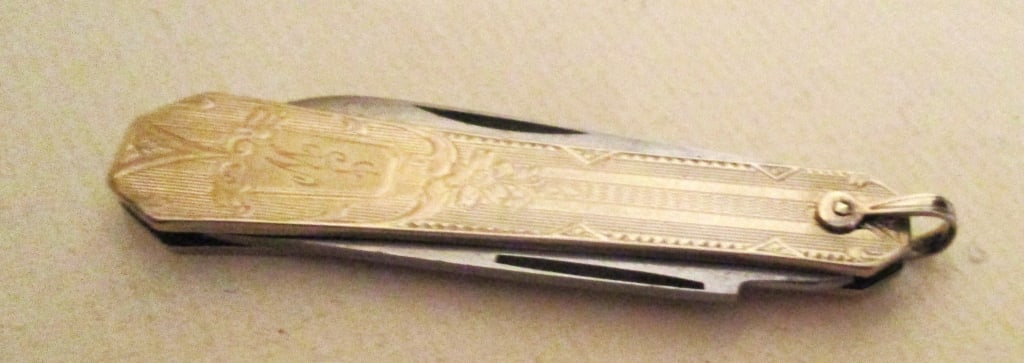 White 14K Gold Jackknife Watch Fob: Lot Consists of a Jackknife in 14K White Gold. Was Most Likely a Pocket Watch Fob. Approximate Size is 2 1/4" Inches Long. Approximately Weight is 9.1 dwt. In Good Condition