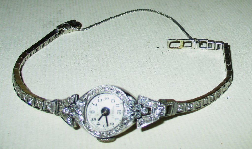 Platinum, 14K White Gold & Diamond Cocktail Watch: Lot Consists of a Lady's Platinum Cocktail Watch Set With Diamonds With a 14K White Gold Band Set With Diamonds. The Maker is Nicolet. CA 1930. Approximate Weight is 10.1 dwt. Not Working.